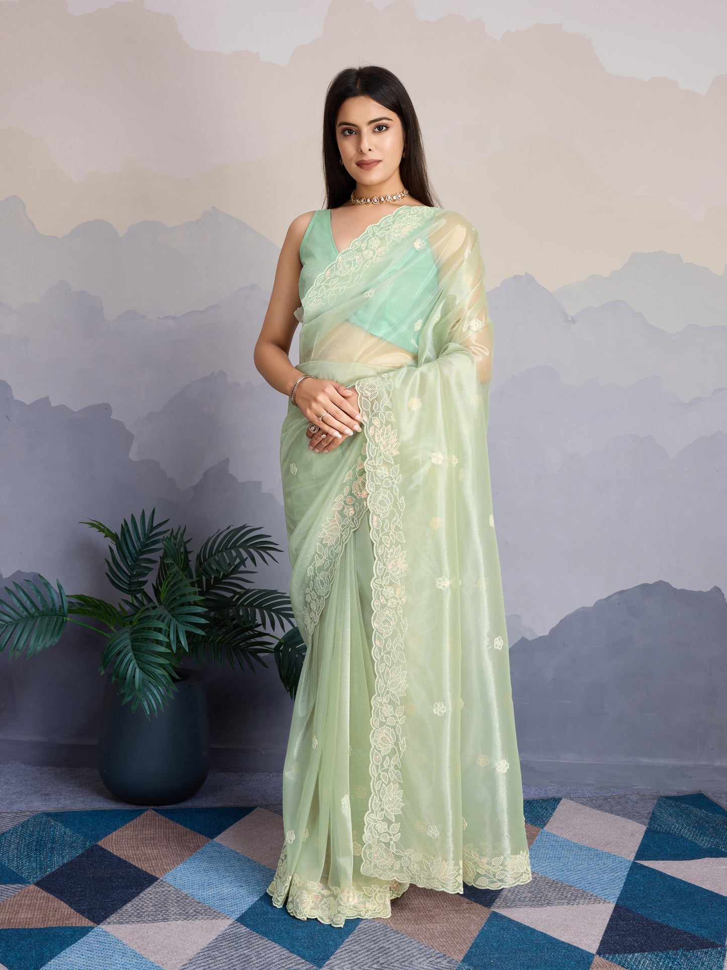 Elegant Pastel Green Gold-Infused Trending Twill Saree