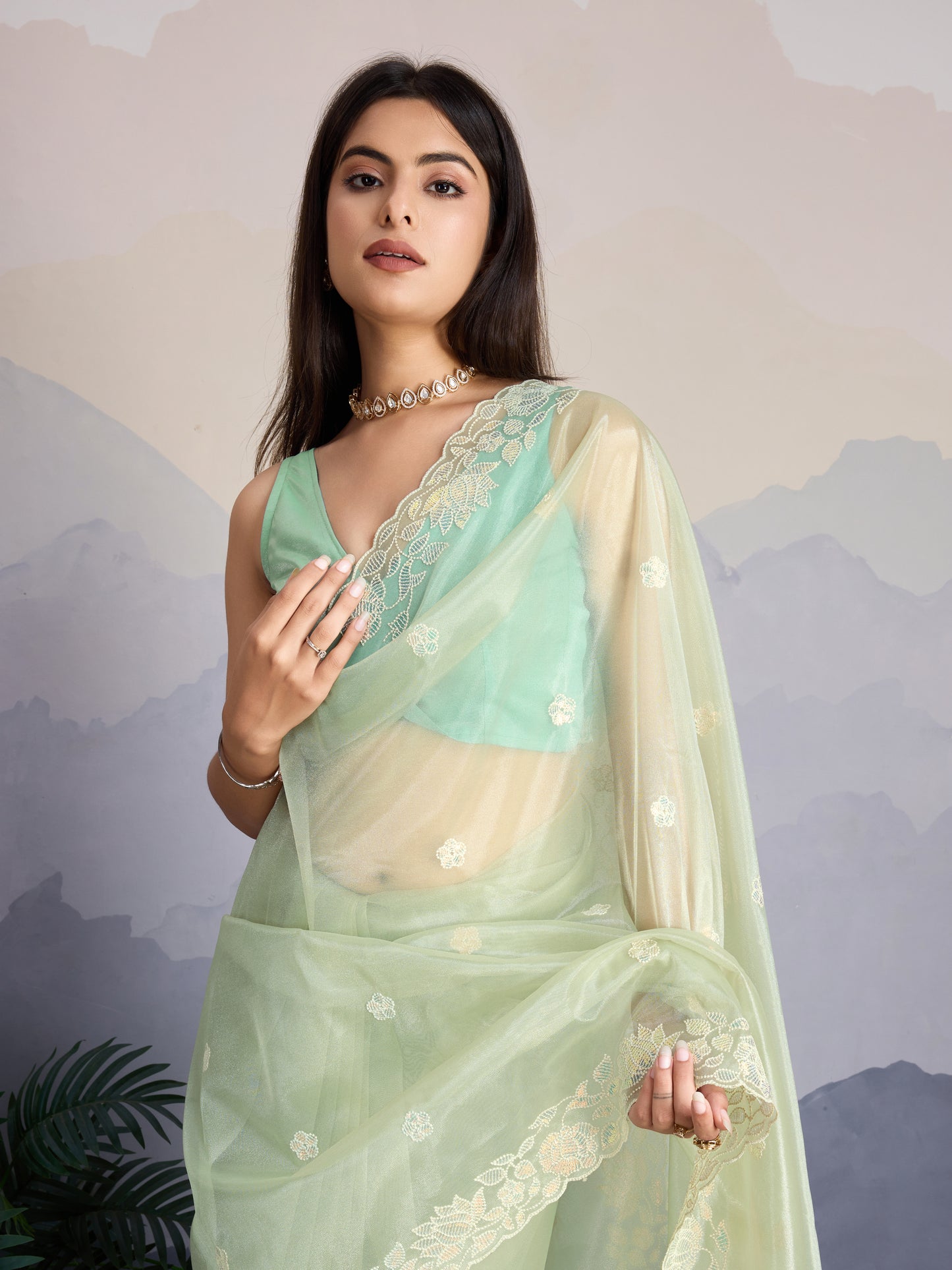 Elegant Pastel Green Gold-Infused Trending Twill Saree